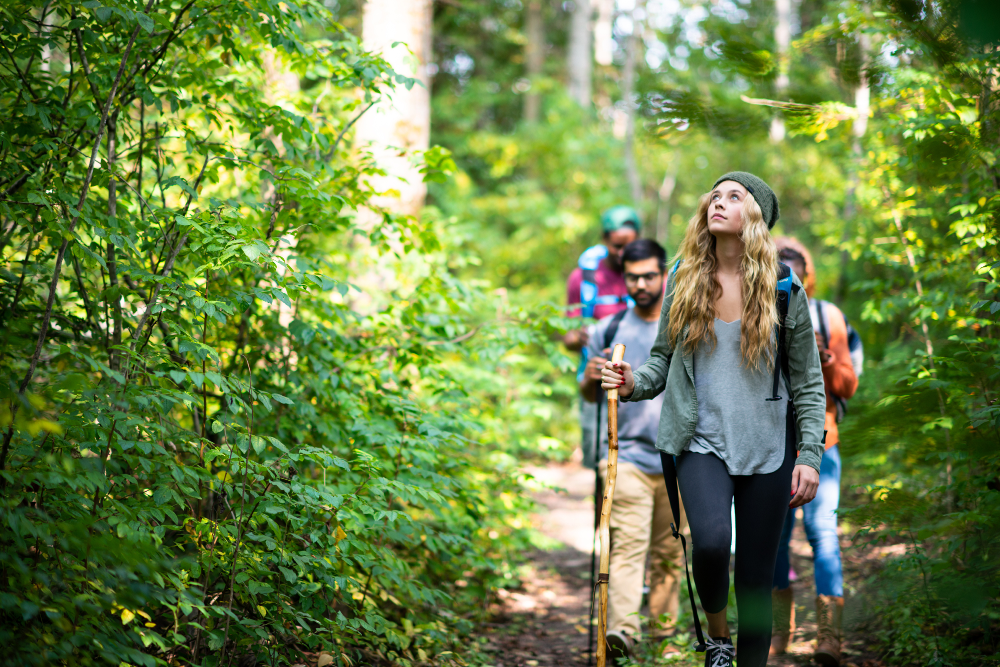 students-adventuring-through-forest-campaign