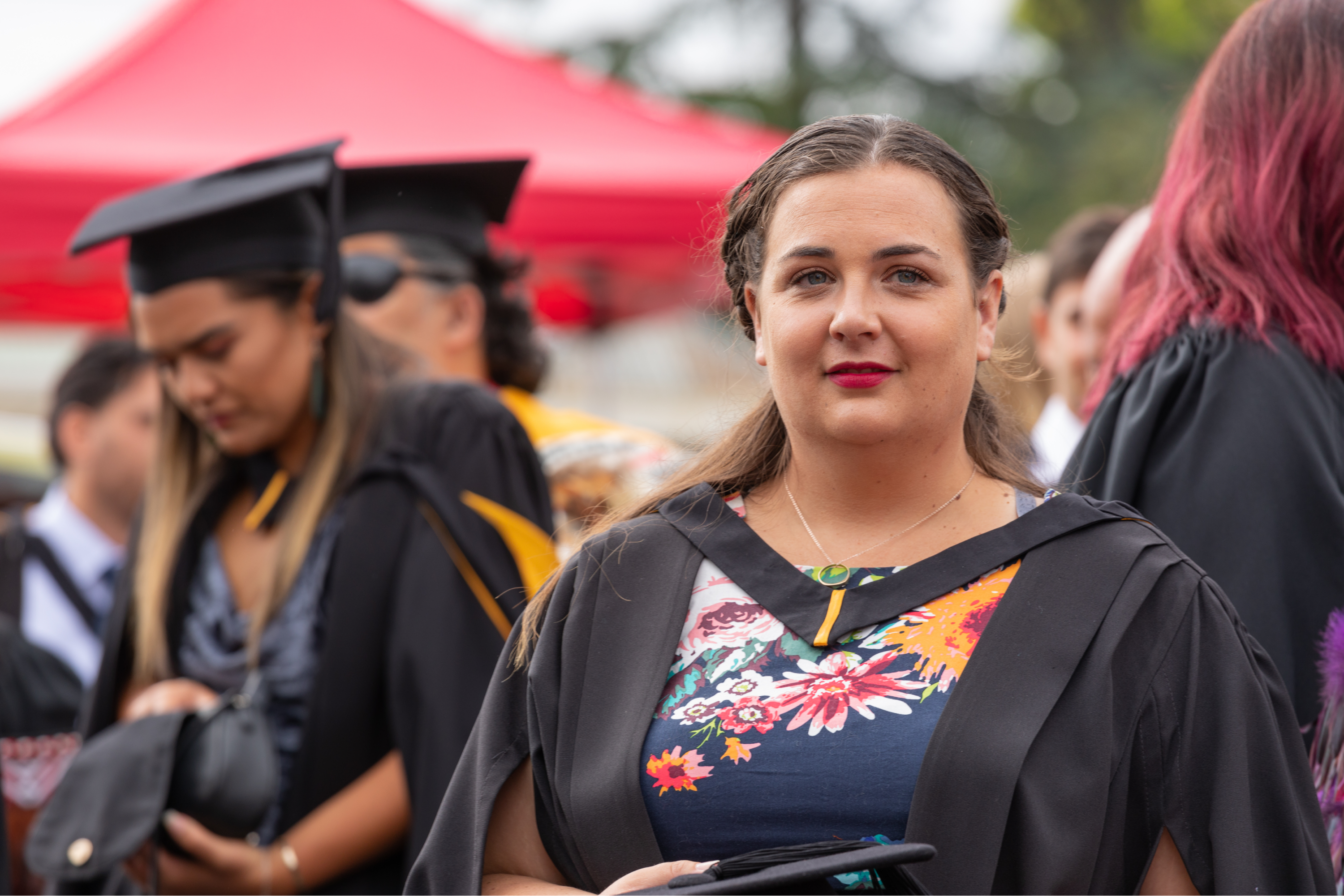 student-graduating-smiling-at-camera