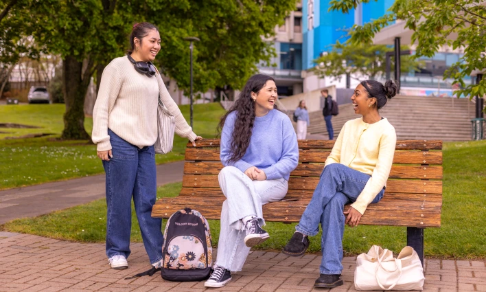 students-sitting-at-campus-green